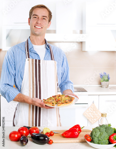 Photo: Young Man Cooking Pizza Young Man Cooking Pizza