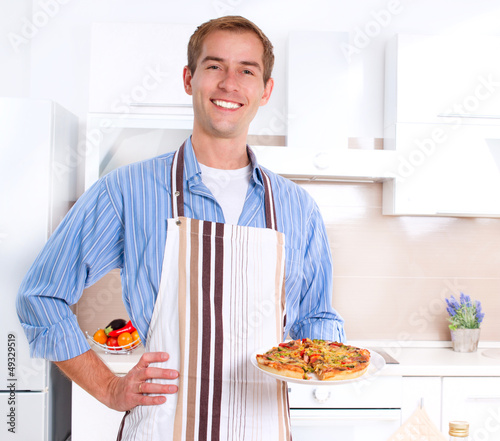 Photo: Young Man Cooking Pizza Young Man Cooking Pizza