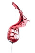 Foto: red wine splashing out of a glass, isolated on white red wine splashing out of a glass, isolated on white