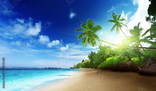 Photo: beach in sunset time on Mahe island in Seychelles beach in sunset time on Mahe island in Seychelles