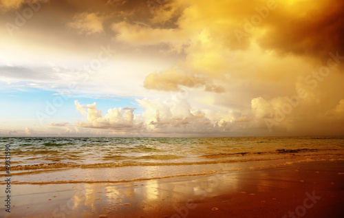 Photo: sunset on the beach of caribbean sea sunset on the beach of caribbean sea