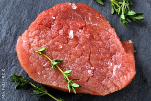 Photo: fresh raw beef meat on cutting board fresh raw beef meat on cutting board