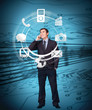 Businessman on the phone admiring wheel of applications 