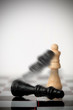 Chess pieces falling over