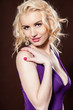 Closeup portrait of a pretty young and happy blonde woman