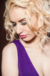 Closeup portrait of a pretty young and happy blonde woman