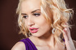 Closeup portrait of a pretty young and happy blonde woman