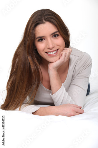 Photo: Woman lying in her bed Woman lying in her bed