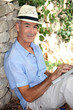 Elderly man relaxing in his garden