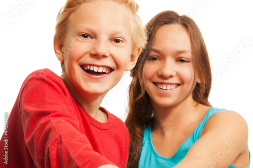 Photo: Laughing teen boy and girl Laughing teen boy and girl