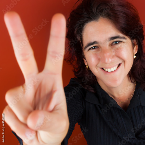 Photo: Hispanic woman doing the victory sign Hispanic woman doing the victory sign