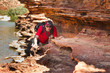 Man sneak along rock edge