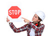 Female laborer pointing stop sign