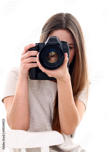 Photo: Young caucasian woman with camera Young caucasian woman with camera