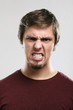 Portrait of young man with angry expression