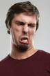 Portrait of young man with silly grimace