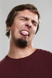 Portrait of young man with silly grimace