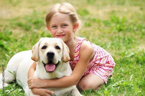 Photo: little girl with her dog little girl with her dog