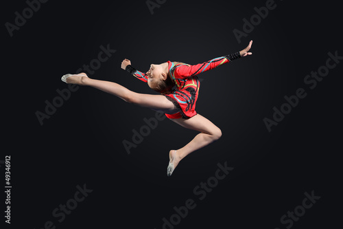 Photo: Young woman in gymnast suit posing Young woman in gymnast suit posing