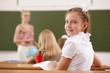 Little girl at school class