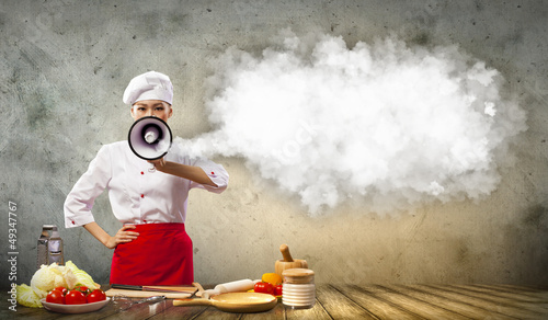 Photo: Asian female cook holding megaphone Asian female cook holding megaphone