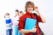Student in red shirt with books