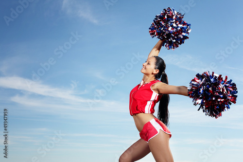 Photo: Young female cheerleader Young female cheerleader