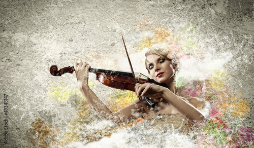 Photo: Gorgeous woman playing on violin Gorgeous woman playing on violin