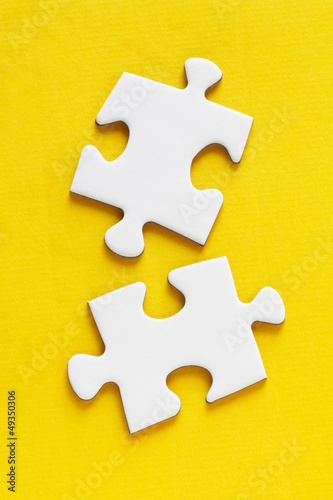 Photo: Jig Saw Puzzle - Two Pieces on Yellow Jig Saw Puzzle - Two Pieces on Yellow