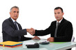Boss welcoming new colleague