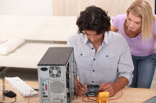 Photo: technician repairing a computer technician repairing a computer