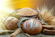Photo: fresh bread and wheat on the wooden fresh bread and wheat on the wooden