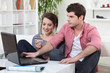 young cute couple shopping online