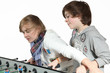 Two boys play table football