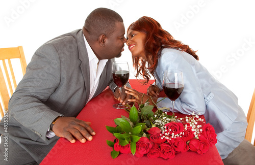 Photo: African American Couple About to Kiss in Romantic Dinner African American Couple About to Kiss in Romantic Dinner