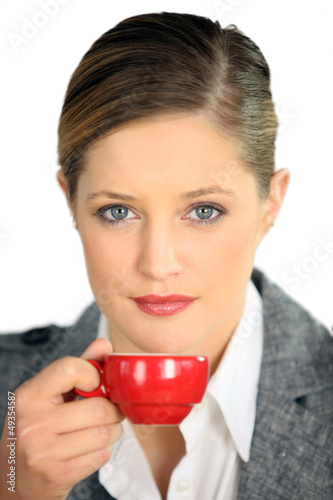 Photo: Woman with red coffee cup Woman with red coffee cup