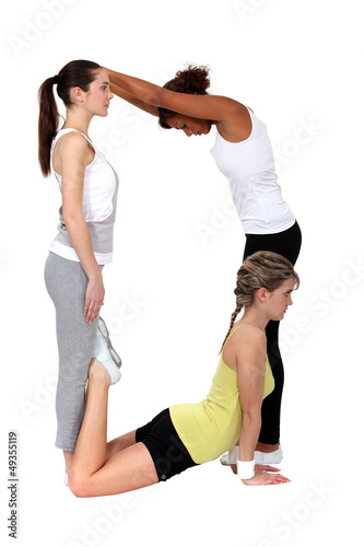 Photo: Women making the letter D Women making the letter D