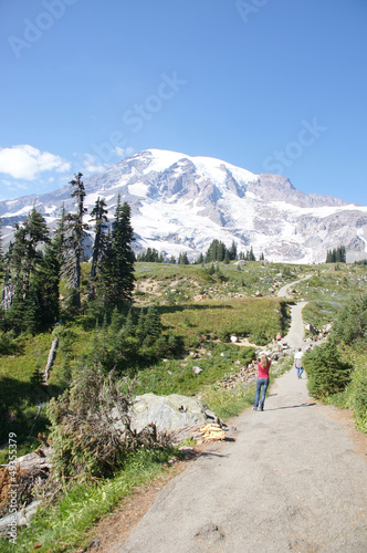 Photo: Tourists explore the meadows and wildflowers Tourists explore the meadows and wildflowers