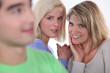 Tow girls gossiping about boy