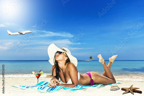 Photo: Beautiful woman on the beach. Beautiful woman on the beach.