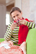 sick woman uses handkerchief