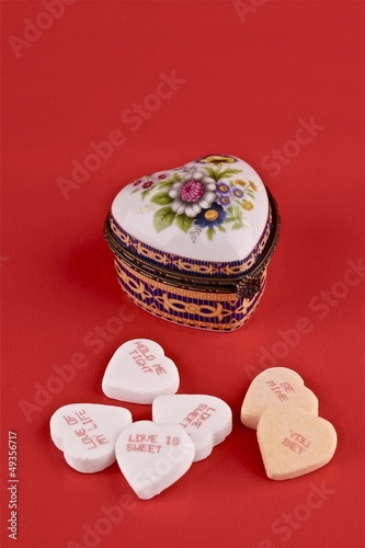 Photo: Valentine concept. Small metal gift box in the shape of a heart. Valentine concept. Small metal gift box in the shape of a heart.