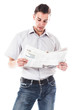Portrait of a businessman reading a daily newspaper