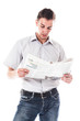 Portrait of a businessman reading a daily newspaper