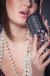 young singer with a retro microphone