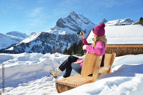 Photo: Girl with a camera in the Swiss Alps Girl with a camera in the Swiss Alps