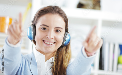 Photo: Happy young woman enjoying music Happy young woman enjoying music