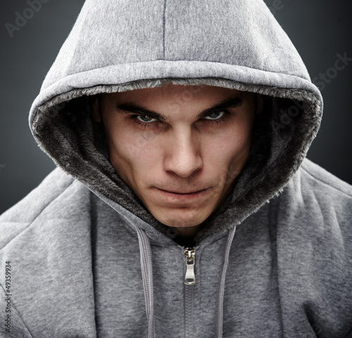 Photo: Close-up portrait of threatening thug Close-up portrait of threatening thug