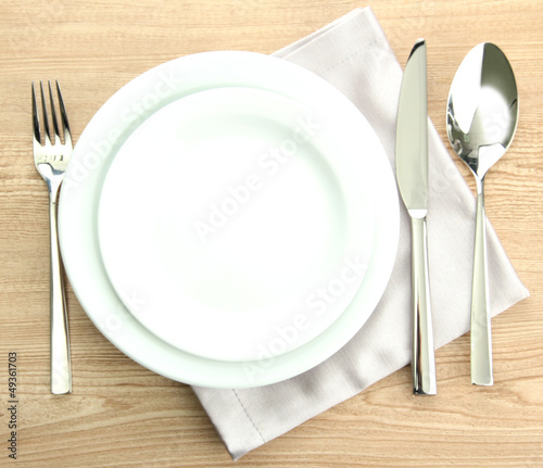 Photo: Table setting on wooden table Table setting on wooden table