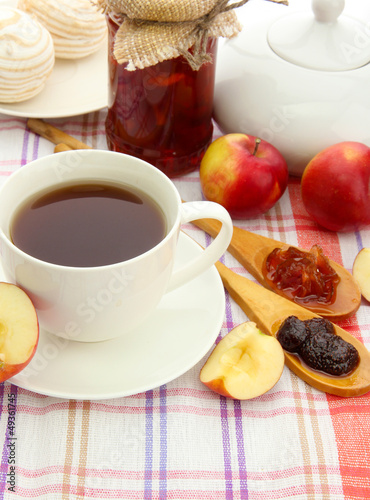 Photo: light breakfast with tea and homemade jam, on tablecloth light breakfast with tea and homemade jam, on tablecloth